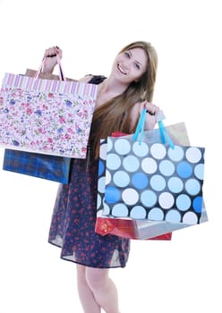 women shopping concept with young lady and colored bags  isolated over white background in studio
