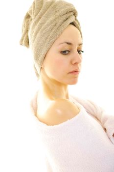 beautiful young woman portrait with towel on head isolated on white