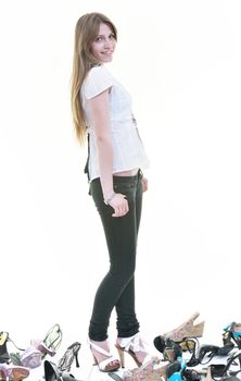 pretty young woman with buying shoes addiction, isolated on white background in studio