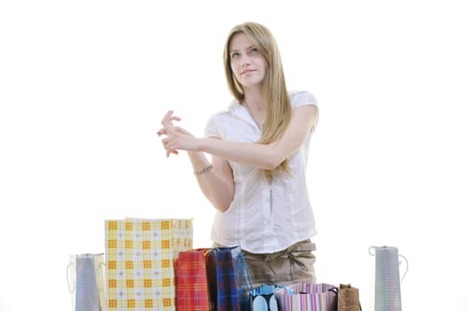 women shopping concept with young lady and colored bags  isolated over white background in studio