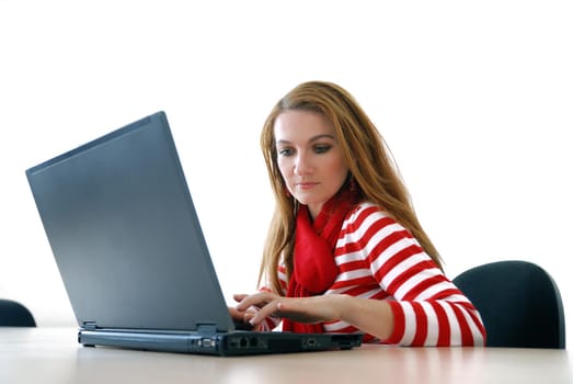 woman in red working on laptop at bright  office