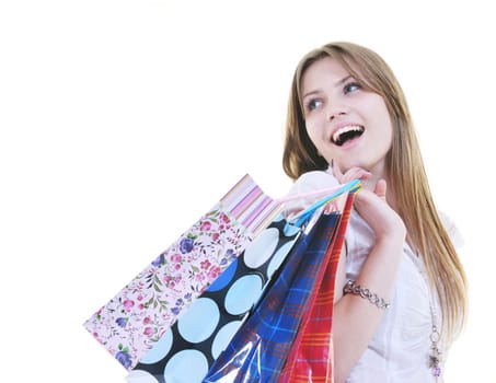women shopping concept with young lady and colored bags  isolated over white background in studio