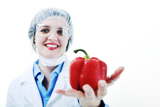 isolated on white young nurse doctor woman with red vegetable food papper representing bio food concept 
