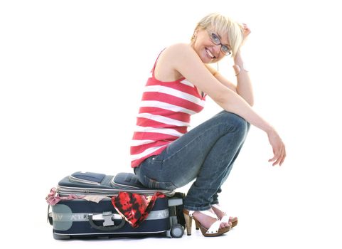 woman tourist packing travel bag isolated on white backgound in studio