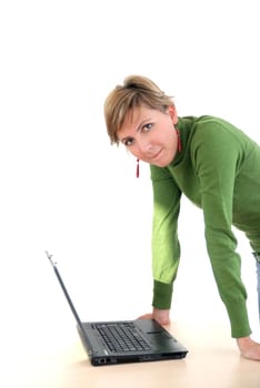 business woman in green standing in office