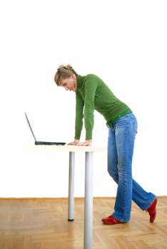 business woman in green standing in office