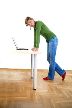 business woman in green standing in office