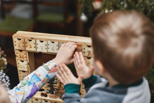 The kids open wooden advent calendar