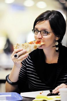 portrait of young woman eat pizza food at restaurant