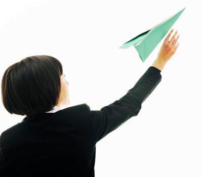 happy young business woman isolated ona white throwing paper airplane 