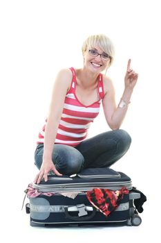 woman tourist packing travel bag isolated on white backgound in studio