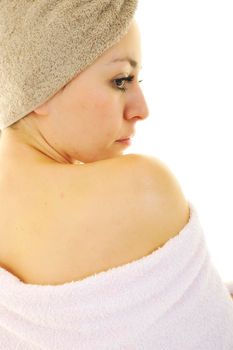 beautiful young woman portrait with towel on head isolated on white