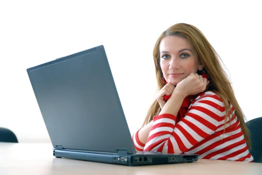 woman in red working on laptop at bright  office