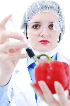 isolated on white young nurse doctor woman with red vegetable food papper representing bio food concept 