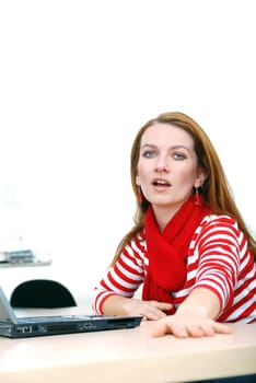 woman in red working on laptop at bright  office