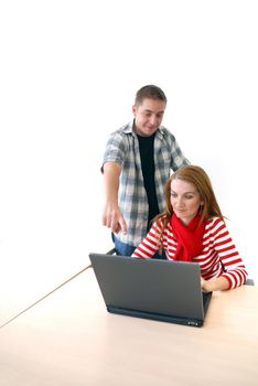 young couple working on laptop at office