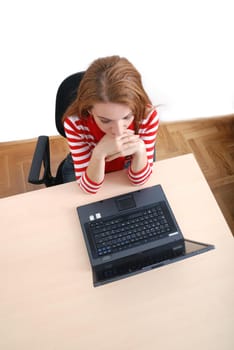 woman in red working on laptop at bright  office