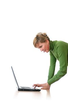 business woman in green standing in office