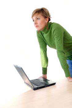 business woman in green standing in office