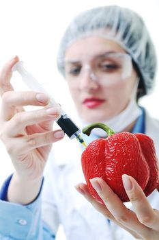 isolated on white young nurse doctor woman with red vegetable food papper representing bio food concept 