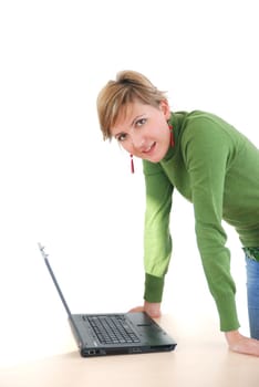 business woman in green standing in office