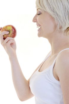 happy young woman eat green apple isolated  on white backround in studio