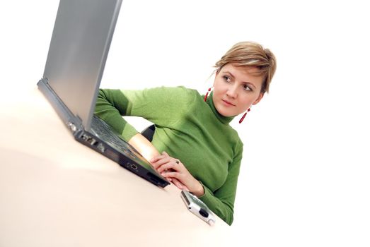 businesswoman in green working on laptop