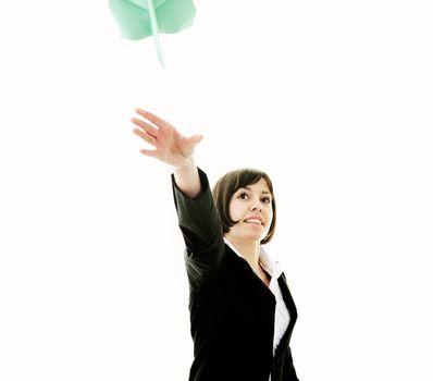happy young business woman isolated ona white throwing paper airplane