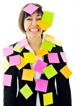 one frustrated young business woman with many of post it representing concept memory and frustration on work