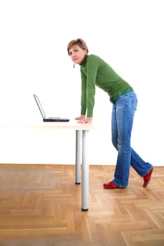 business woman in green standing in office