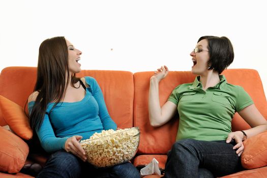 two young woman isolated on white looking tv and cry 