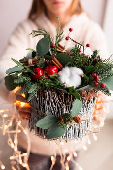 Christmas decoration with carnations, chrysanthemums santini, brunia and fir. Christmas spirit and mood