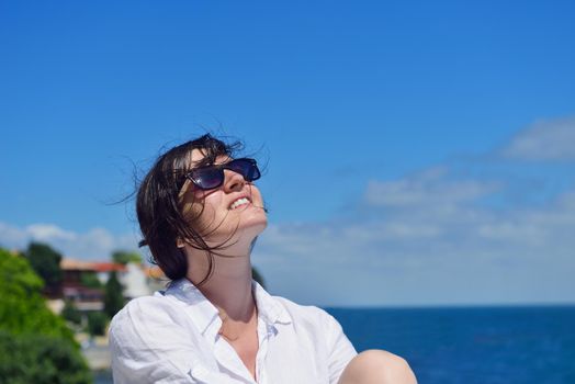 healthy Happy  young woman with spreading arms, blue sky with clouds in background  - copyspace