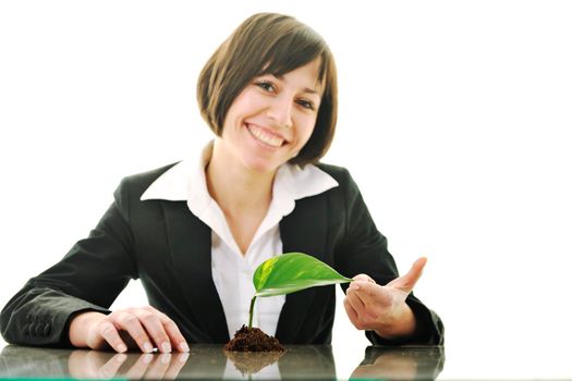 young business woman isolated on white holding green plant with small leaf and waiting to grow