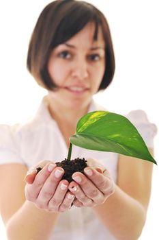 young business woman isolated on white holding green plant with small leaf and waiting to grow