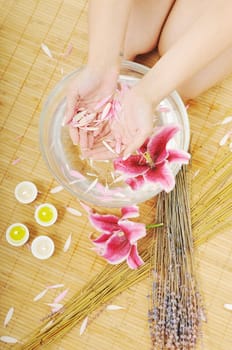 hand spa and beauty treatment with aroma and flowers in water