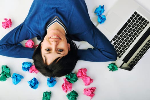 young beautiful brunette student woman working on laptop computer and finding solutions