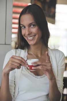 beautiful young woman at caffe break in restaurant