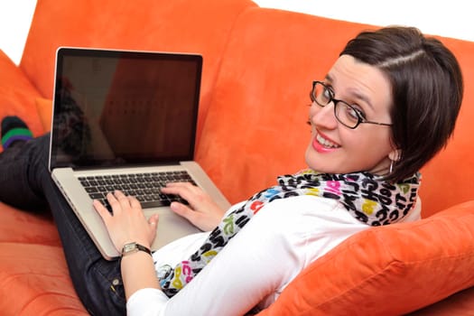 adult, beautiful, beauty, brunette, casual, caucasian, computer, couch, face, female, fun, girl, happy, home, house, indoor, indoors, interior, internet, keyboard, laptop, leisure, life, lifestyle, living, living room, modern, notebook, one, online, people, person, portrait, pretty, relax, room, smile, smiling, sofa, student, technology, typing, using, web, white, window, wireless, woman, work, young