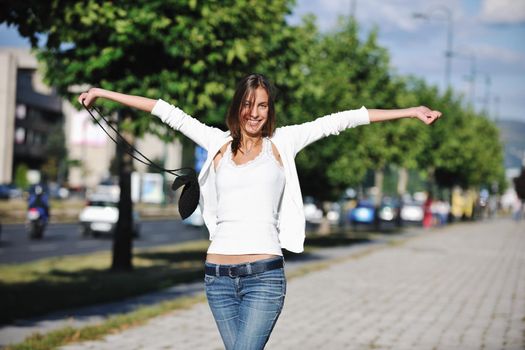 beautiful young woman have fun and relax at city street on beautiful sunny day