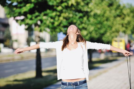 beautiful young woman have fun and relax at city street on beautiful sunny day
