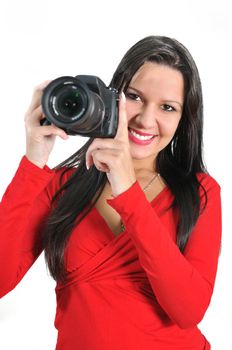 Young woman holding camera in hand taking picture isolated