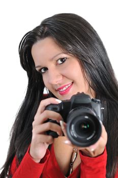 Young woman holding camera in hand taking picture isolated