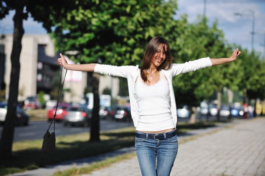 beautiful young woman have fun and relax at city street on beautiful sunny day