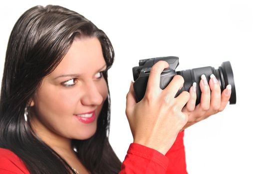 Young woman holding camera in hand taking picture isolated