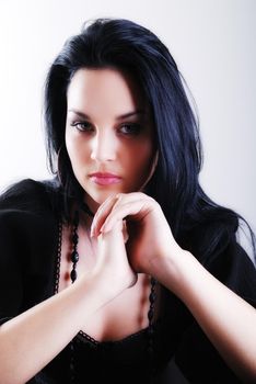 one brunette woman posing in studio 