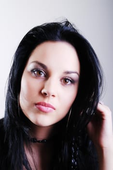 one brunette woman posing in studio 