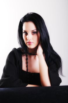 one brunette woman posing in studio 