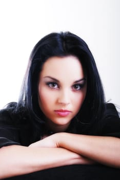 one brunette woman posing in studio 