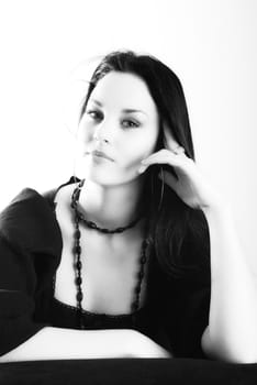 one brunette woman posing in studio 